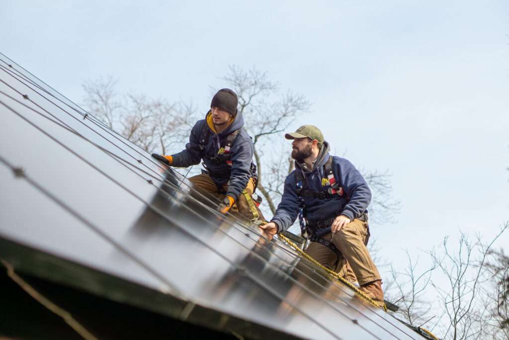 Lehmann Electrical team installing solar panels