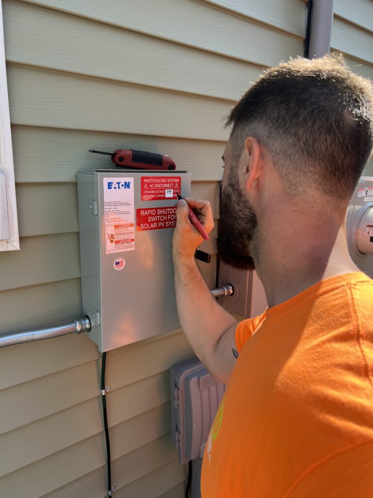 Electrician labeling circuits in an electrical panel