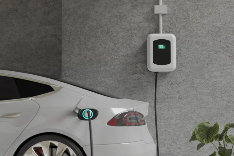Wall-mounted EV charger plugged into an electric car