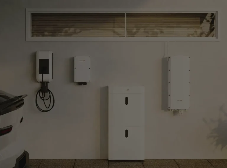 EV charger mounted on a wall with conduit running to nearby electrical gear