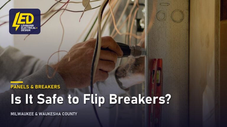 Electrician working inside an open breaker panel, titled Is It Safe to Flip Breakers?