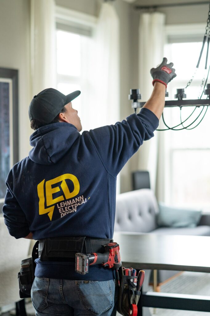 Lehmann Electrical technician installing wiring at a residential electrical panel