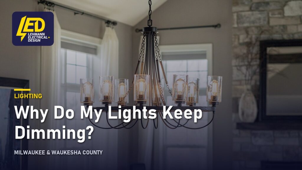 Eight-light black metal chandelier with clear glass shades in a residential living room, titled Why Do My Lights Keep Dimming?