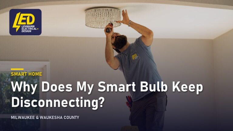 Electrician on a ladder installing a decorative drum-style ceiling light, titled Why Does My Smart Bulb Keep Disconnecting?